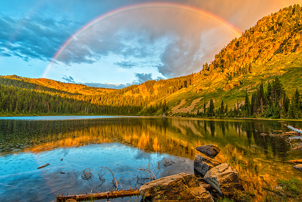 Morning pre-storm rainbow over Norther Blossom Lake on the CDA/Cabinet Divide by Aaron Theisen
